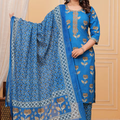 Woman wearing a bright blue handblock printed cotton kurta set with a coordinated Kota Doriya dupatta featuring floral motifs.