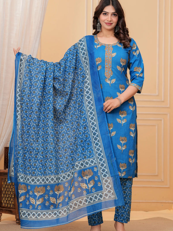 Woman wearing a bright blue handblock printed cotton kurta set with a coordinated Kota Doriya dupatta featuring floral motifs.