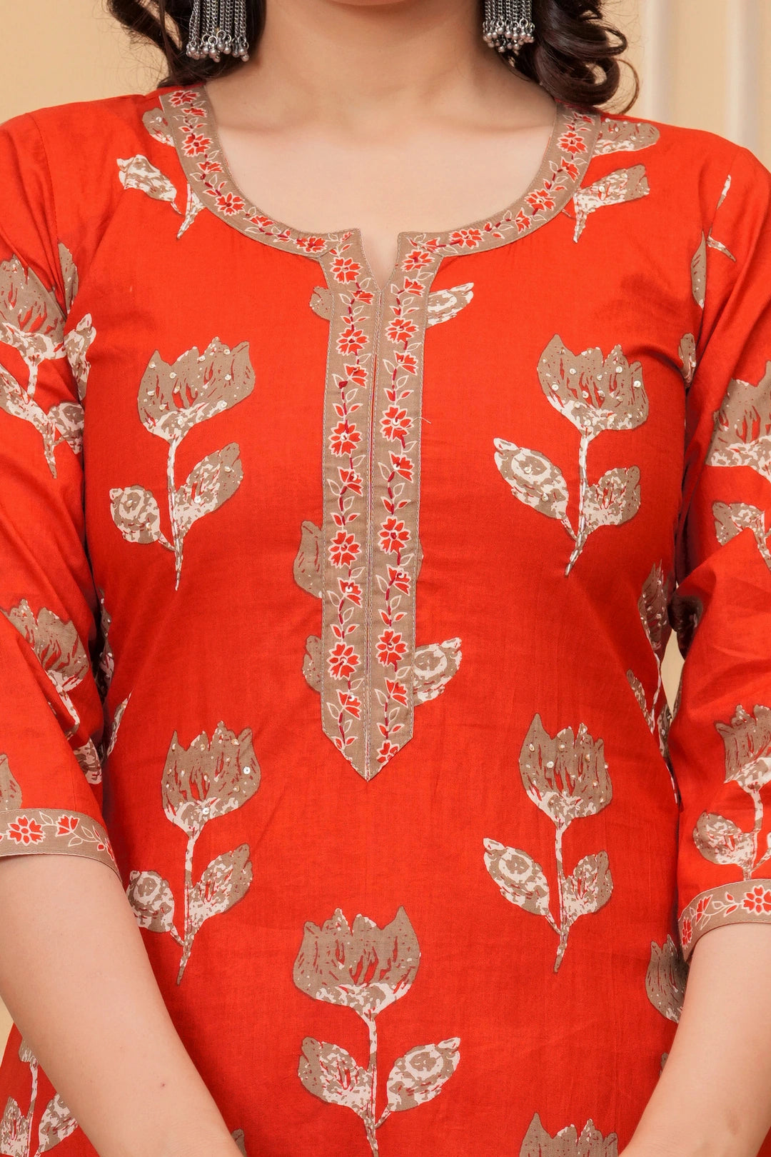 A woman wearing a navy blue handblock printed cotton kurta with a large geometric print dupatta in red, blue, and white.