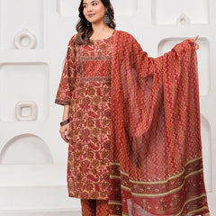 Model wearing a maroon handblock printed cotton kurta with floral motifs and matching zig-zag pants with a printed dupatta