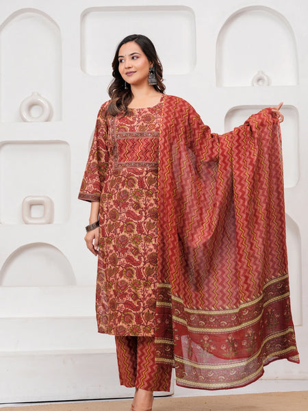 Model wearing a maroon handblock printed cotton kurta with floral motifs and matching zig-zag pants with a printed dupatta