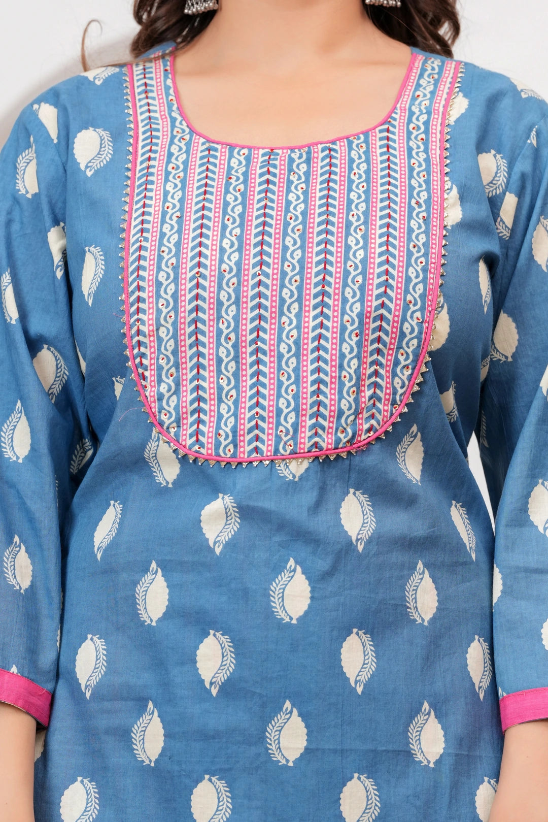 Woman in a blue Jaipur handblock printed cotton kurta with leaf motifs and a designer off-white dupatta with pink borders.