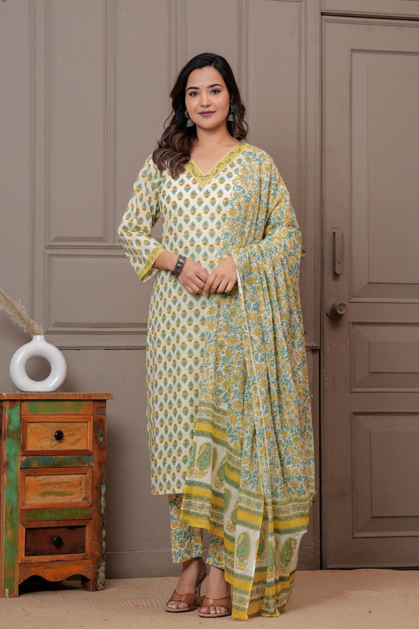 Woman wearing an off-white cotton kurta set with yellow and green Jaipur handblock floral prints and a matching paisley dupatta.