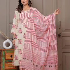 Woman in a cream-colored straight kurta with pink handblock floral prints and a chevron patterned pink leheriya dupatta.