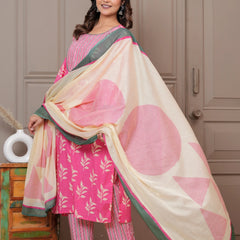 Women wearing a pink floral handblock printed kurta with matching patterned pants and a cream-colored printed dupatta with green borders.