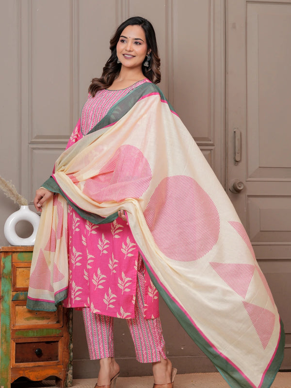 Women wearing a pink floral handblock printed kurta with matching patterned pants and a cream-colored printed dupatta with green borders.