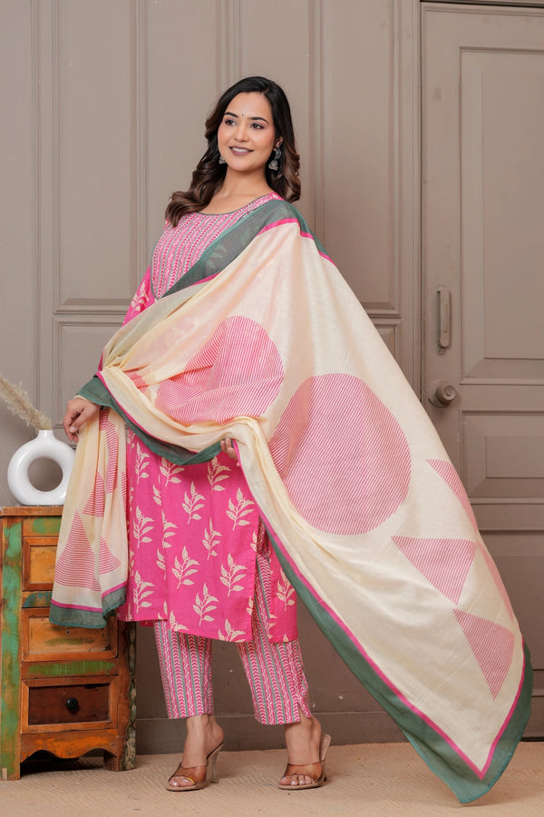 Women wearing a pink floral handblock printed kurta with matching patterned pants and a cream-colored printed dupatta with green borders.