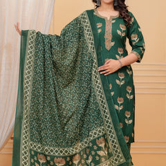 Model posing in a dark green handblock printed straight kurta with an embroidered neck, matching printed pants, and a heavily bordered Chanderi dupatta.