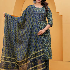 A woman posing in a navy blue handblock printed cotton kurta with floral patterns, featuring matching zigzag pants and a printed dupatta.