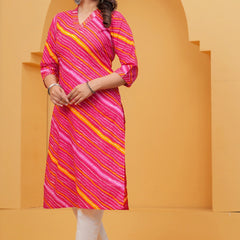 Woman wearing a bright pink Leheriya printed cotton kurta with orange and white stripes, featuring a V-neck and three-quarter sleeves.